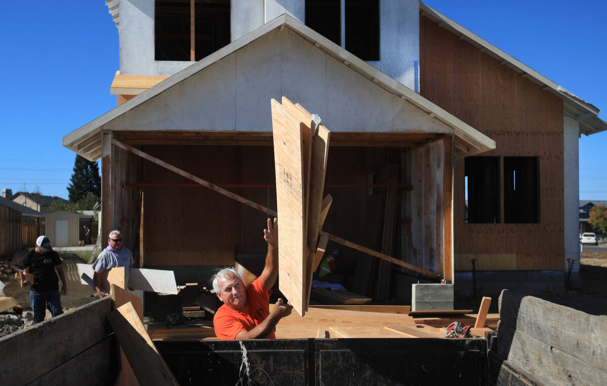 Picture of Wolff Contracting staff disposing of unused materials at the Coffey Park Community Build Project featured on https://www.pressdemocrat.com/article/news/santa-rosa-contractor-vows-to-finish-free-of-charge-womans-half-built-ho/?utm_campaign=trueAnthem%3A%20Trending%20Content&utm_medium=trueAnthem&utm_source=facebook&fbclid=IwAR2pe9M2tX9IXUXlnX7oQhwjiYG8kW3nCzV2PFcwKiK7je_6_kkadw8veQY